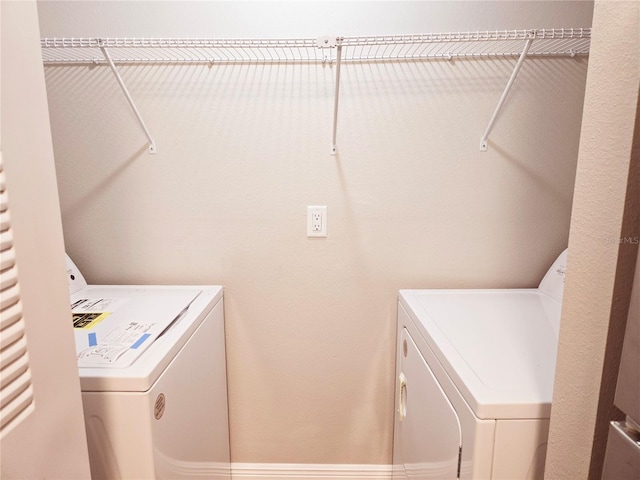 laundry area featuring laundry area and separate washer and dryer