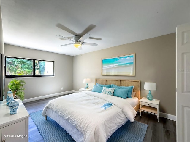 bedroom featuring baseboards, a ceiling fan, and wood finished floors