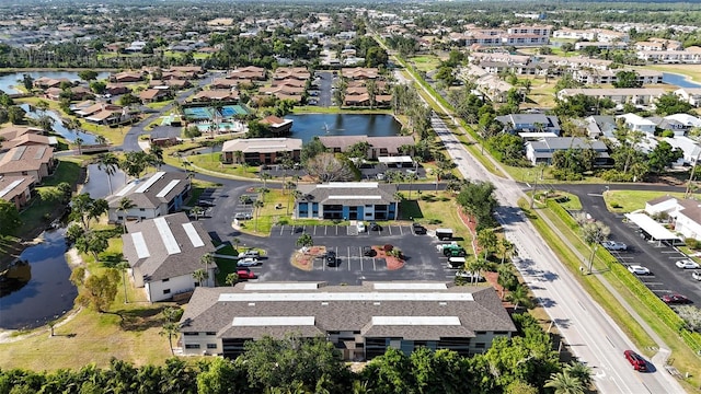 bird's eye view with a water view and a residential view