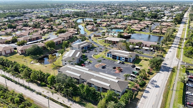 bird's eye view featuring a residential view and a water view