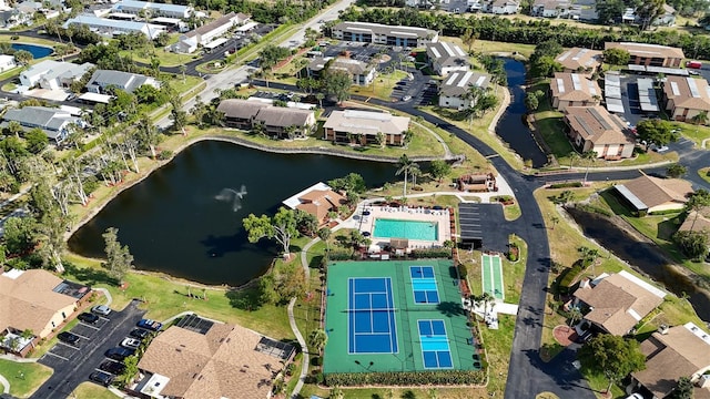 drone / aerial view with a water view and a residential view