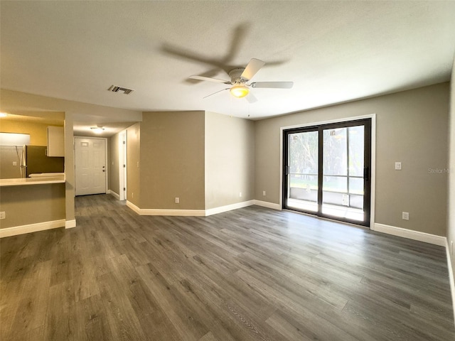 17426 Birchwood Ln Unit 3, Fort Myers, FL 33908 - unfurnished living room with a ceiling fan, dark wood-style floors, and baseboards