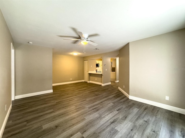 17426 Birchwood Ln Unit 3, Fort Myers, FL 33908 - unfurnished living room featuring ceiling fan, dark wood-type flooring, and baseboards