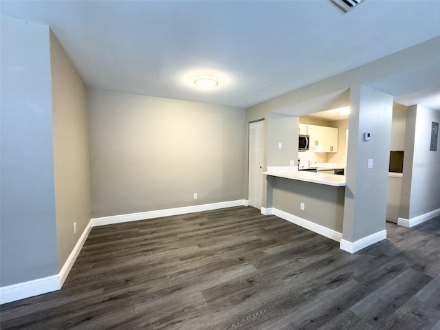 17426 Birchwood Ln Unit 3, Fort Myers, FL 33908 - unfurnished living room with dark wood finished floors and baseboards