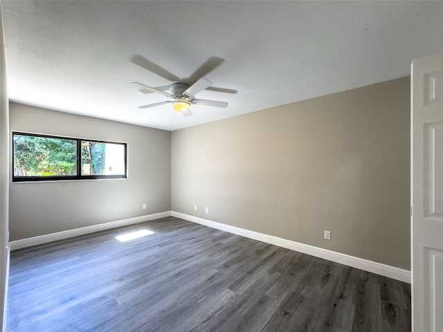17426 Birchwood Ln Unit 3, Fort Myers, FL 33908 - unfurnished room with dark wood-type flooring, baseboards, and a ceiling fan