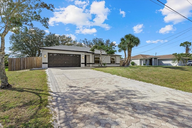 ranch-style house with an attached garage, fence, decorative driveway, a front yard, and stucco siding