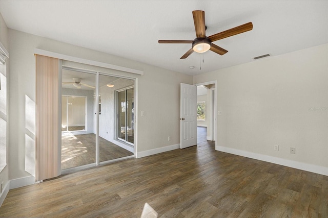 unfurnished bedroom with ceiling fan, wood finished floors, visible vents, baseboards, and access to outside