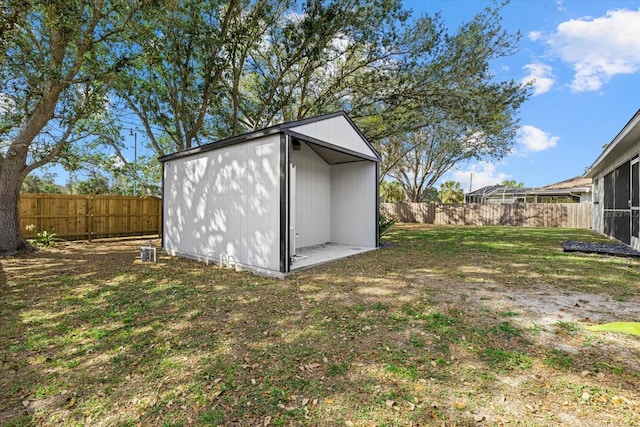 view of shed with a fenced backyard