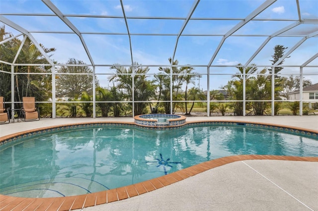 view of swimming pool featuring a patio area, a pool with connected hot tub, and glass enclosure