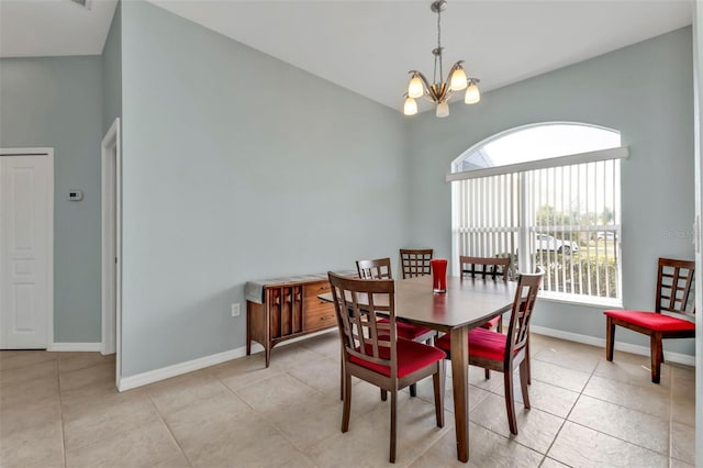 dining room with baseboards, light tile patterned floors, and an inviting chandelier