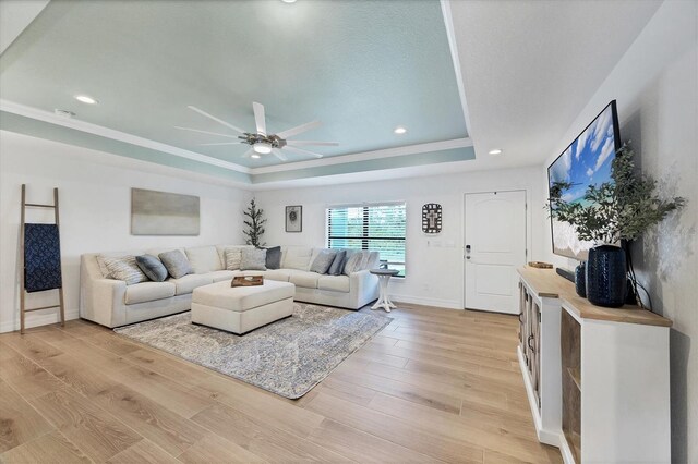 14325 Mcfarland Ave, Port Charlotte, FL 33981 - living area featuring a tray ceiling, ceiling fan, light wood-style floors, recessed lighting, and baseboards