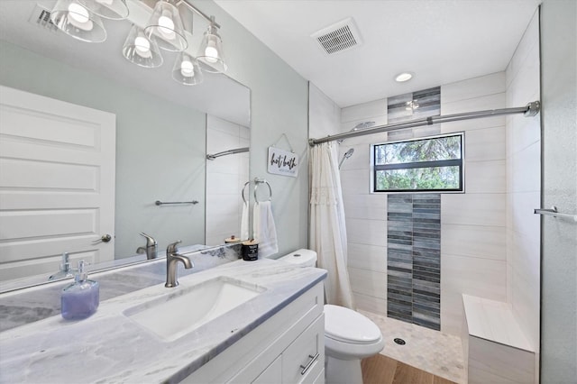 14325 Mcfarland Ave, Port Charlotte, FL 33981 - full bath featuring tiled shower, toilet, vanity, and wood finished floors