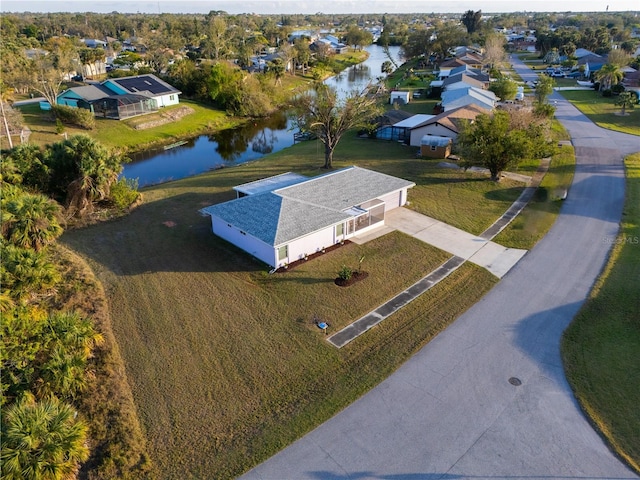 drone / aerial view with a water view