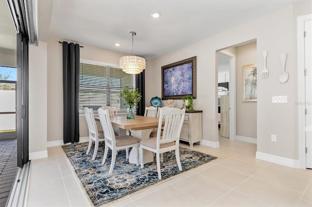 dining room with light tile patterned floors, recessed lighting, and baseboards