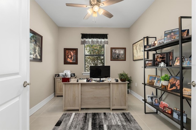 home office featuring light tile patterned floors, baseboards, and a ceiling fan