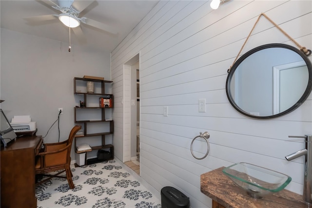 office with ceiling fan and a sink