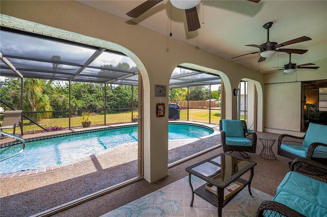 view of swimming pool featuring a patio, a lanai, a grill, fence, and a fenced in pool