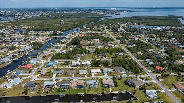 aerial view with a water view and a residential view