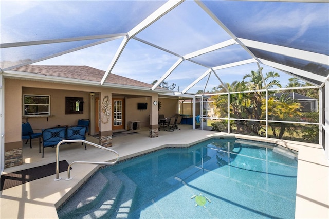 outdoor pool featuring a lanai, a patio area, and outdoor lounge area