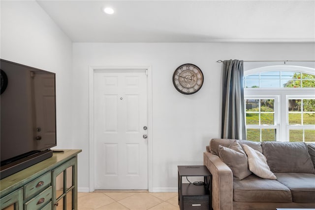 interior space with light tile patterned flooring and baseboards