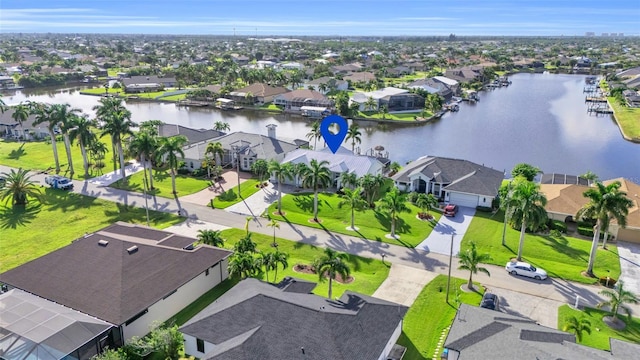 birds eye view of property featuring a residential view and a water view