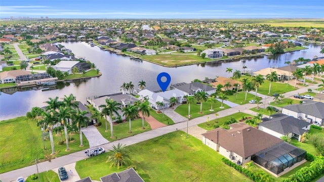 birds eye view of property featuring a residential view and a water view