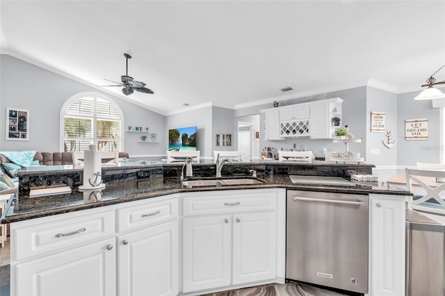 kitchen with lofted ceiling, ceiling fan, open floor plan, stainless steel dishwasher, and a sink