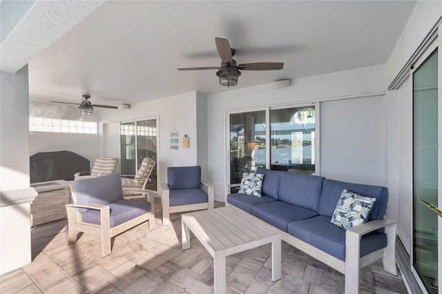 view of patio / terrace featuring an outdoor hangout area and a ceiling fan