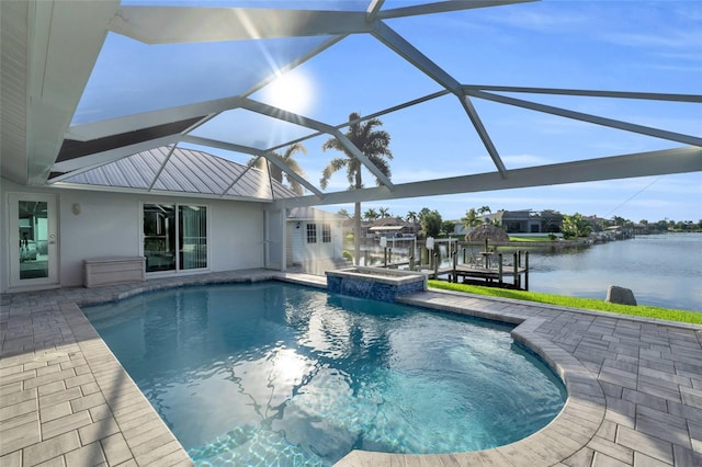 view of pool featuring a water view, a patio area, a lanai, and a dock