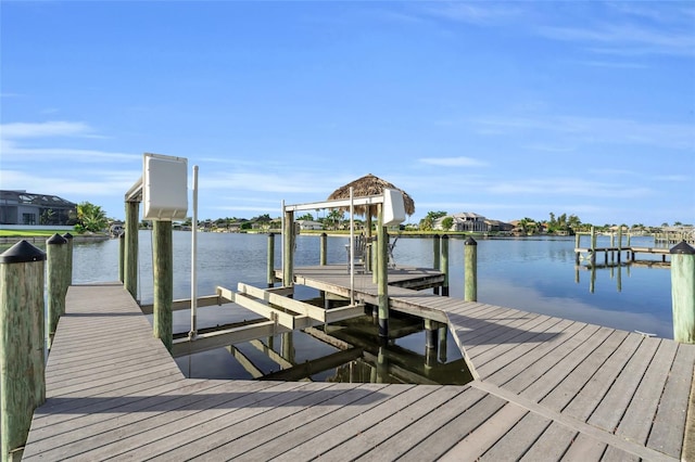 dock area featuring a water view and boat lift