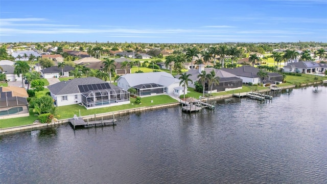 birds eye view of property featuring a residential view and a water view