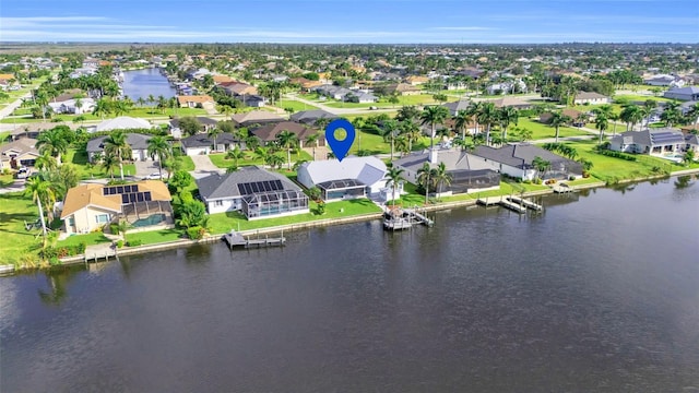 birds eye view of property with a residential view and a water view