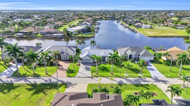 bird's eye view with a residential view and a water view