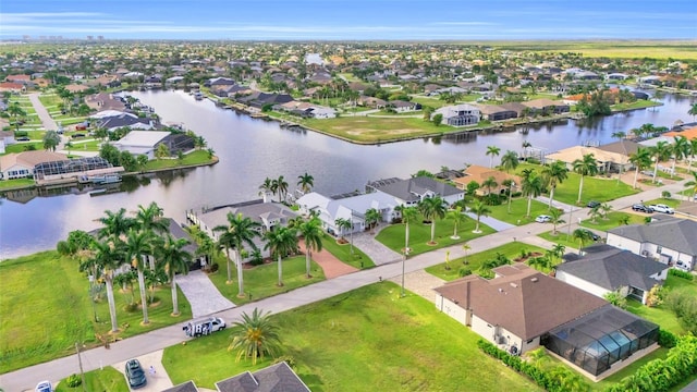 bird's eye view featuring a residential view and a water view