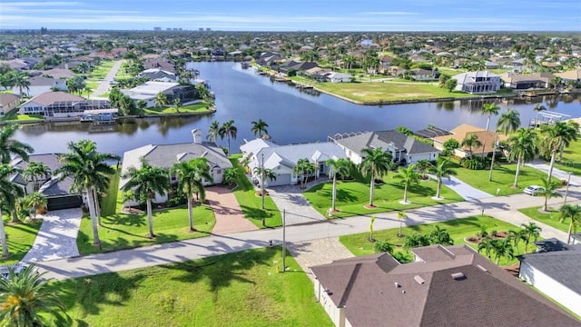 birds eye view of property with a residential view and a water view