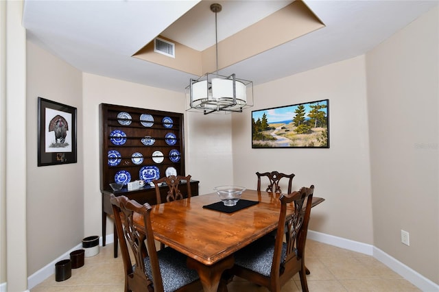 dining area featuring visible vents, baseboards, and light tile patterned floors