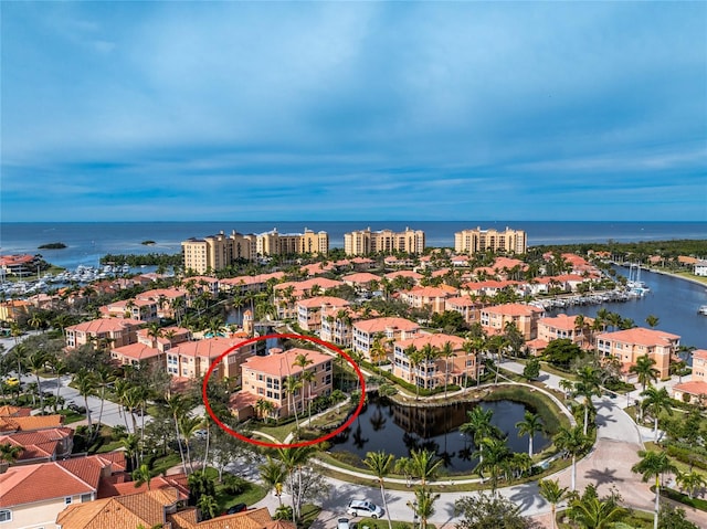 drone / aerial view with a view of city and a water view