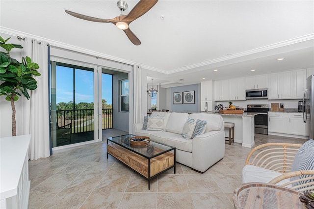 living area featuring a ceiling fan, recessed lighting, and ornamental molding