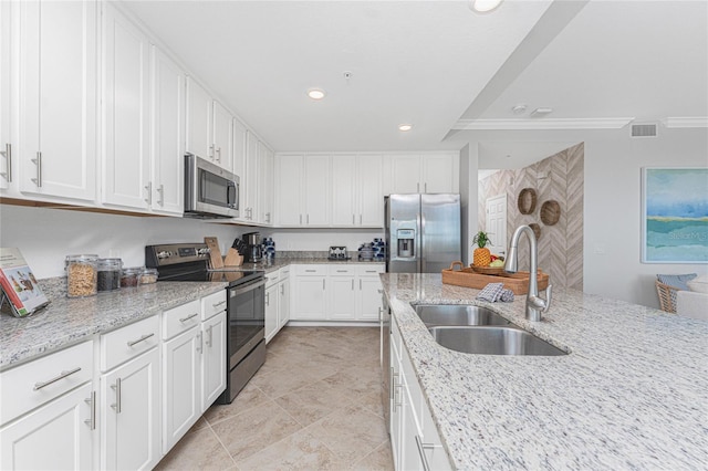 kitchen with visible vents, stainless steel appliances, white cabinetry, a sink, and recessed lighting