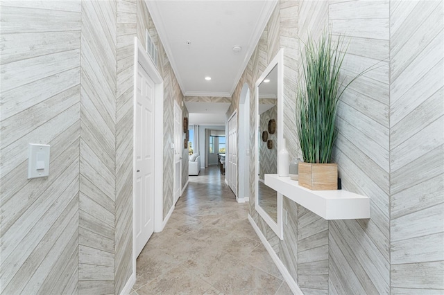 corridor with recessed lighting, crown molding, and baseboards