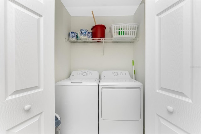 laundry area featuring washing machine and dryer and laundry area