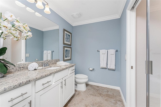 bathroom with toilet, vanity, baseboards, ornamental molding, and tile patterned floors