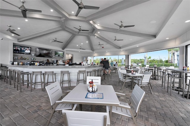 dining area featuring high vaulted ceiling, beamed ceiling, and recessed lighting