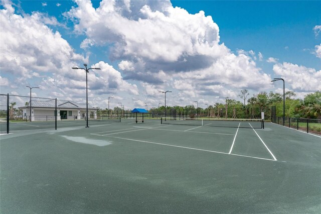 view of tennis court with fence