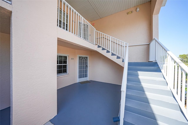 view of patio featuring stairway