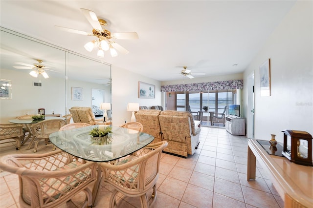 dining room featuring light tile patterned floors and visible vents