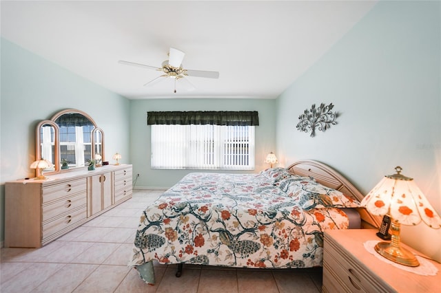 bedroom featuring light tile patterned floors and a ceiling fan