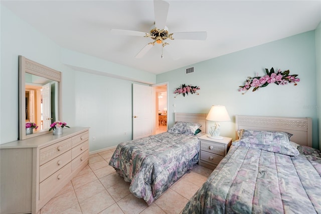 bedroom featuring visible vents, ceiling fan, and light tile patterned flooring