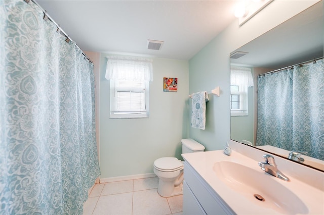 bathroom with visible vents, baseboards, toilet, tile patterned flooring, and vanity