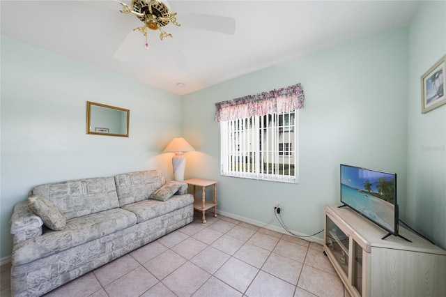 living room featuring a ceiling fan, light tile patterned flooring, and baseboards